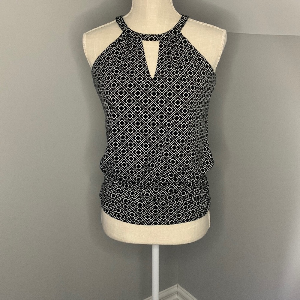 Woman top, ,white, and black ,light used.